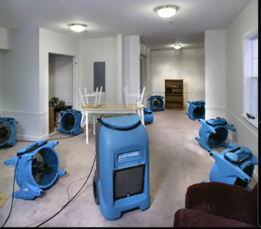 Air movers and dehumidifier setup for Water Damage Restoration in Rye